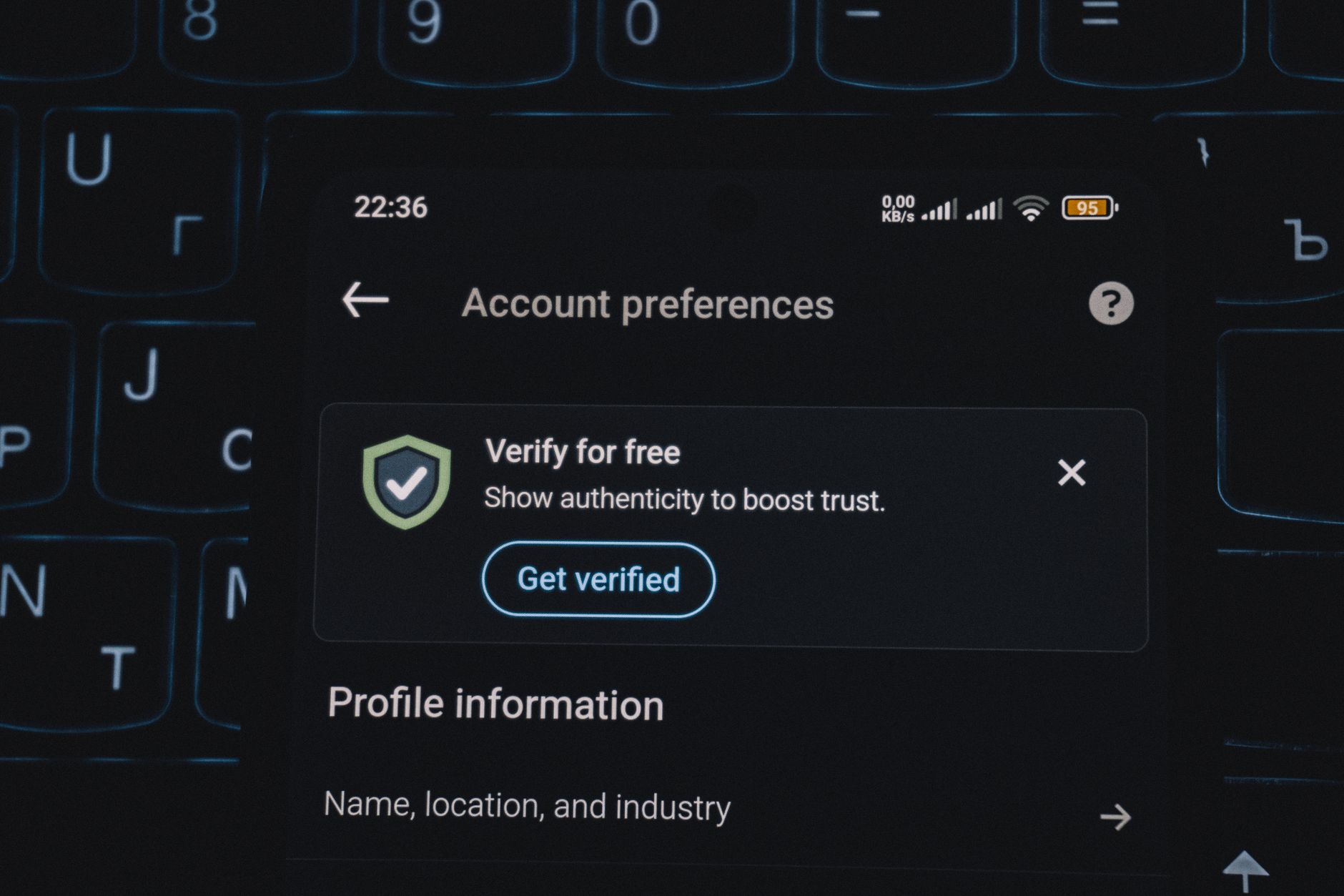Close-up of a smartphone screen displaying account verification alert. Ideal for security and authenticity themes.